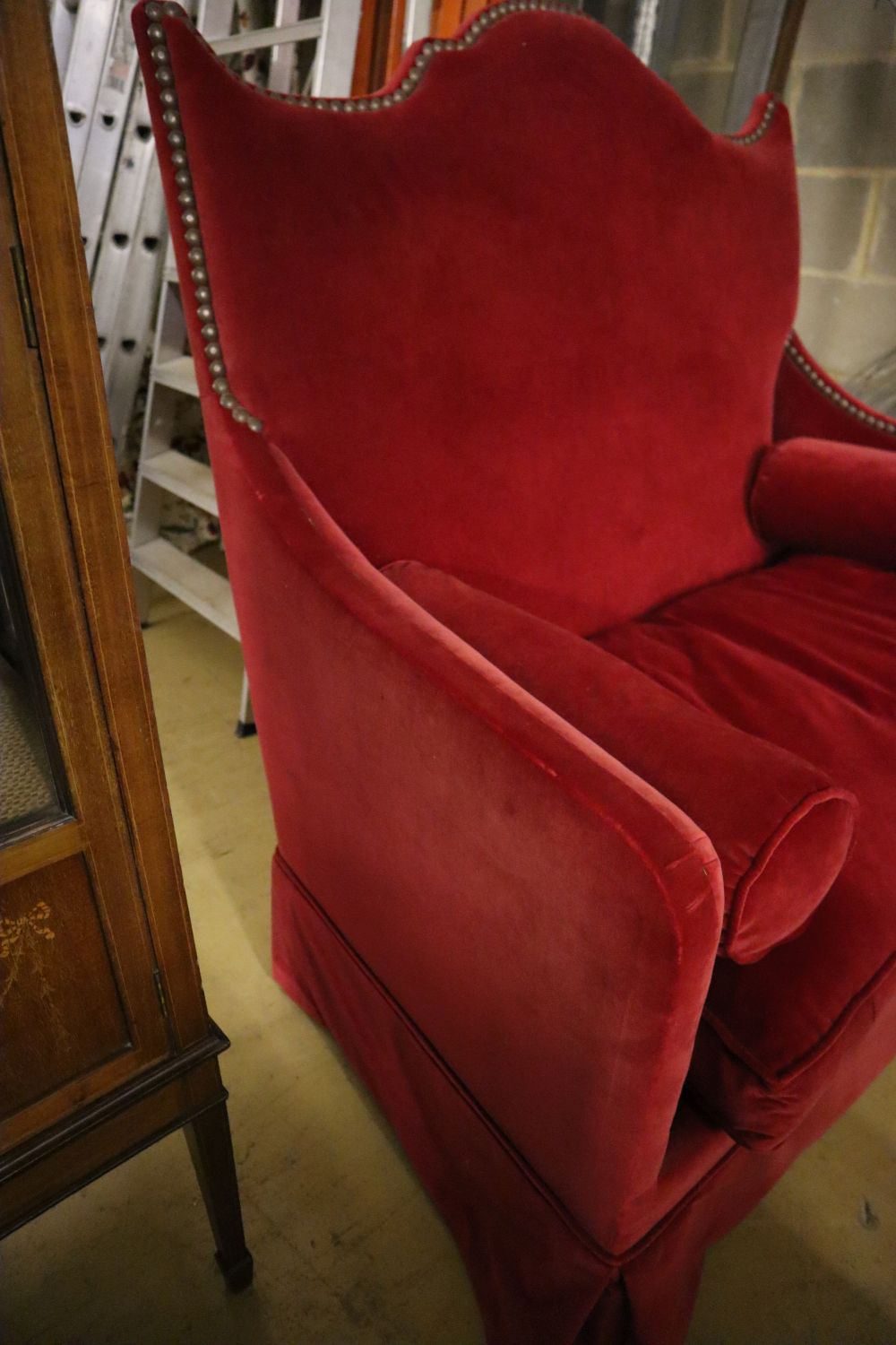 An Yves Halard two-seater sofa covered in red velvet, width 125cm depth 85cm height 132cm